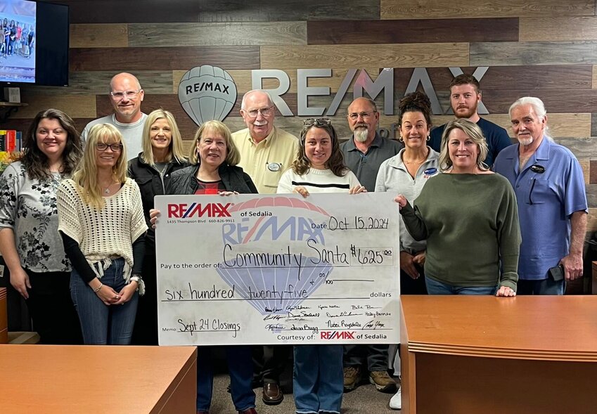 RE/MAX of Sedalia recently donated $625 to Pettis County Community Santa through its Heart of Sedalia Foundation. Each month, the agents donate a portion of earnings from their transactions to help support various local charities. Pictured from left Kyscha Martin, Samantha Bean, Ryan Wiedeman, Joy Wenner, Carol McMillan, Dave Wiedeman, Billie Barnes, Steve Goodwin, Nicci Ragsdale, Angie Yeager, Roman Repnitskiy and Dennis Hagen.


Photo courtesy of Re/Max of Sedalia. 