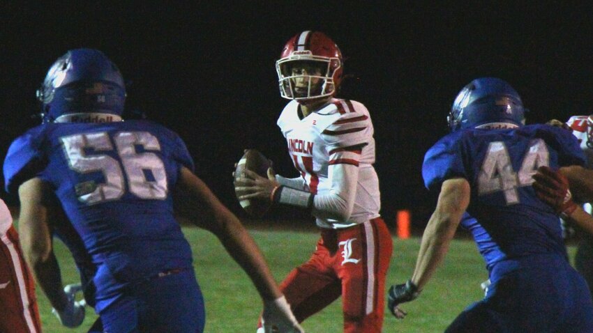 The Lincoln defense swarms to tackle a Cole Camp runner during the game Friday, Oct. 18.


Photo by Jack Denebeim | Democrat