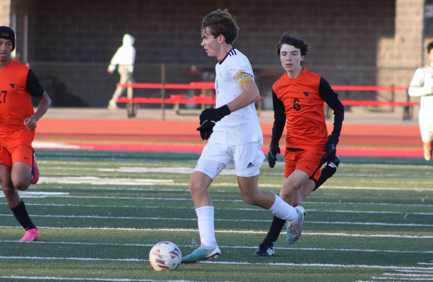 Sacred Heart senior Jackson Manning&nbsp;works on the ball in a 3-2 victory over Oak Grove in Odessa on Oct. 31. Manning helped the Gremlins win a district title in soccer last week, then finished top-20 at the Class 1 Boys Cross Country State Championship on Friday.   PhotoCredit: Photo courtesy of Sacred Heart Athletics