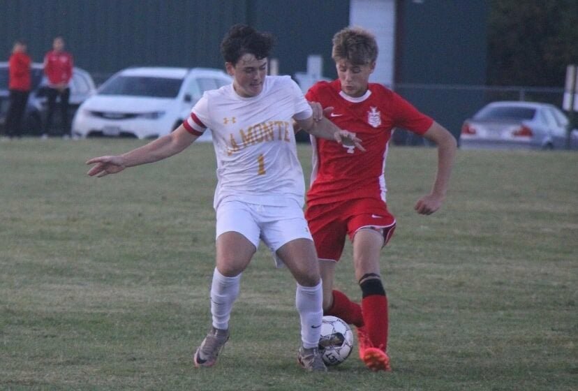 La Monte junior Carter Breshears (1) battles for the ball with a Sacred Heart defender during the game on Sept. 24. Breshears earned All-Kaysinger Conference honors Monday, Nov. 11.   File photo by Jack Denebeim | Democrat