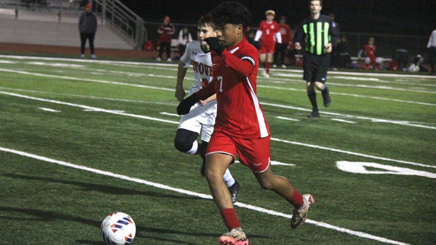 Sacred Heart junior Yovanny Cardenas dribbles the ball during the Class 1 District 5 championship game on Nov. 7. Cardenas scored a goal for the Gremlins in the Class 1 state quarterfinals Saturday, Nov. 16.   File photo by Jack Denebeim | Democrat