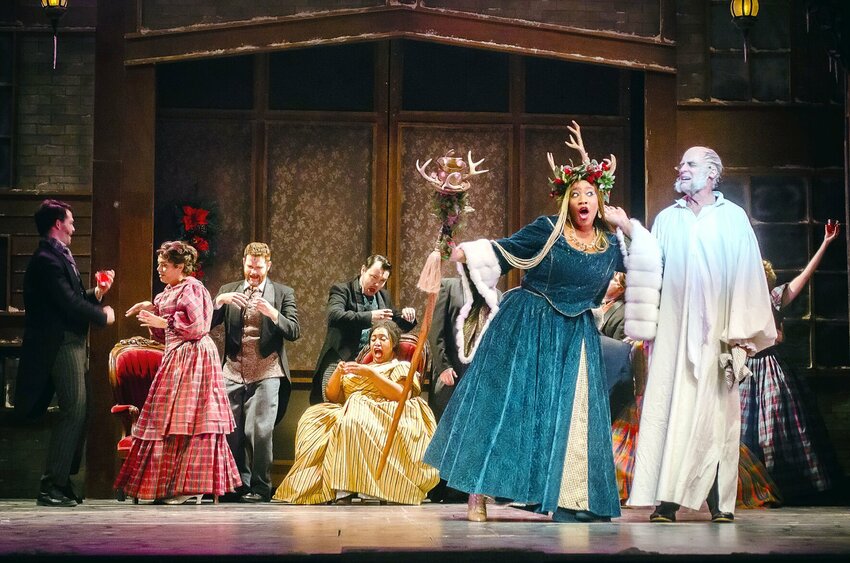 Eliza Brielle, as the Ghost of Christmas Present, Don Richard, as Scrooge, and the cast of &quot;A Christmas Carol&quot; in the 2023 performance at the Arrow Rock Lyceum Theatre. The 2024 production will be performed Dec. 13-22   Photo courtesy of&nbsp;Ryan J. Zirngibl