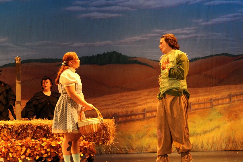 Dorothy (Faith Barkefelt) meets Scarecrow (Harrison Ray) on her journey down the yellow brick road.   Photo by Kayla Nilges | Special to the Democrat