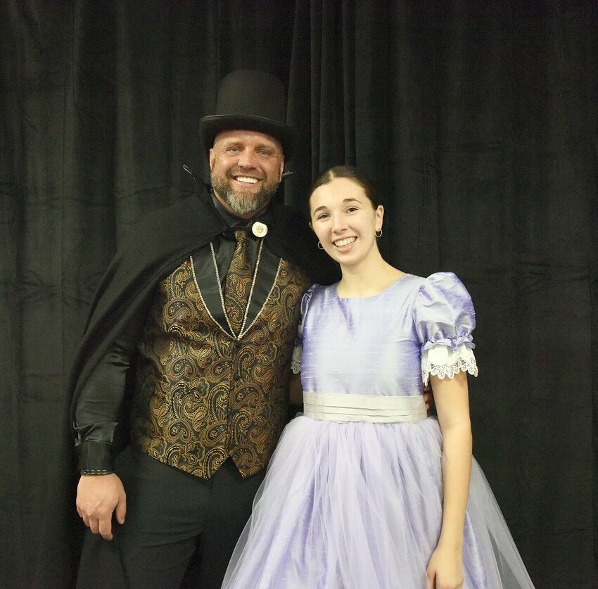 On Saturday, Dec. 14, Michael Boeschen, who plays Uncle Drosselmeyer, and Ashlyn Gerlt, who plays Clara, pose for a photo during a rehearsal in Studio A Dance Conservancy's &quot;The Tale of the Nutcracker.&quot; The Studio will host the performance on Saturday, Dec. 21, and Sunday, Dec. 22, at the Heckart Performing Arts Center.   Photo by Faith Bemiss-McKinney | Democrat