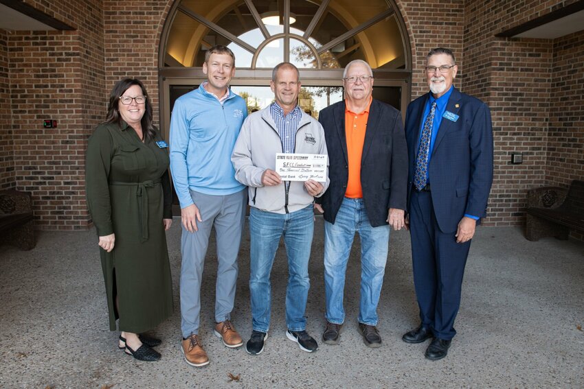 Mary Treuner, SFCC Foundation director; Kyle Weymuth and Kyle Herrick, capital campaign co-chairs; Larry McCown, representing State Fair Speedway; and Dr. Brent Bates, SFCC president, pose after the presentation of a $1,000 donation to the &ldquo;Driving Growth, Harvesting Tomorrow&rdquo; capital campaign on Oct. 31.   Photo courtesy of State Fair Community College&nbsp;
