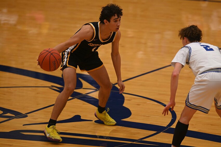 Smith-Cotton senior Jakobe Linn dribbles the ball up court during last season's W-K Shootout at State Fair Community College.   File photo by Bryan Everson | Democrat