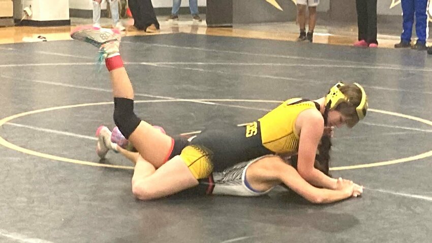 Smith-Cotton sophomore Sarah Davis wrestles her opponent at the Excelsior Springs Tournament on Dec. 13. Despite losing her match in the dual against Capital City on Tuesday, Jan. 14, Davis did enough to secure the 40-39 win for the Lady Tigers.   Photo courtesy of Nicki Renfrow via Bob Satnan