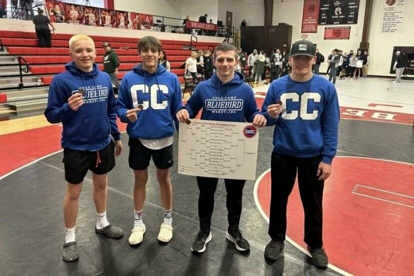 Cole Camp juniors Grant Rodriguez, Clayton Archambault, Makiah Murguia and Teagan Sharp celebrate after qualifying for state during the Class 1 District 2 Tournament at Butler High School on Saturday, Feb. 22. Rodriguez, third from left, was the district champion of the 165-pound weight class.   Photo courtesy of Cole Camp athletics