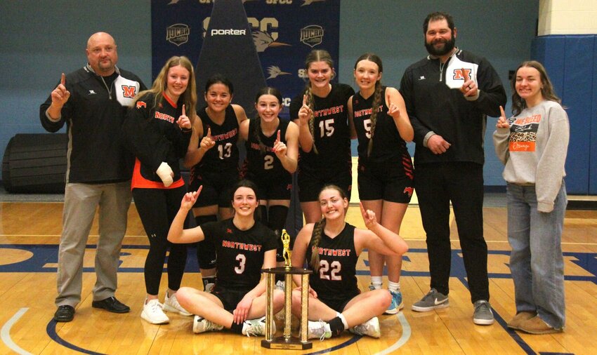 The Northwest girls basketball team celebrates defeating Stover 41-34 in the Kaysinger Conference Tournament championship game Saturday, Feb. 8, at State Fair Community College.   File photo by Jack Denebeim | Democrat