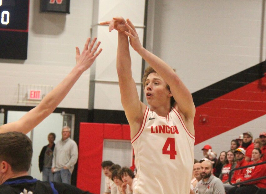 Lincoln junior Dawson Parrott attempts a 3-point shot during the game against St. Paul Lutheran on Monday, March 3, at Lincoln High School.   Photo by Jack Denebeim | Democrat