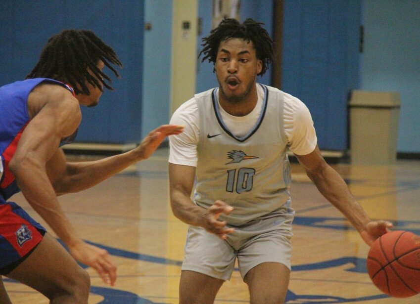 State Fair Community College sophomore Mosa Osagie drives past a Missouri State University - West Plains defender during the Region 16 Tournament quarterfinal game on Tuesday, March 4, at the Fred E. Davis Multipurpose Center.   Photo by Jack Denebeim | Democrat