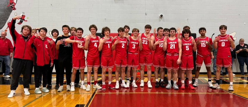 The Lincoln boys basketball team celebrates after defeating Gallatin 48-40 in the Class 2 state quarterfinals on Friday, March 7, at Chillicothe High School. The Cardinals advance to their first state semifinal since 1985.   Photo courtesy of Lincoln athletics