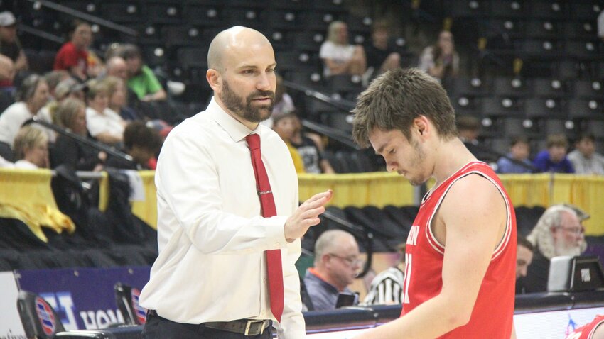 Lincoln boys basketball head coach Tyler Burke, left, consoles junior Braydn Benham during the Class 2 state semifinal game against Eugene on Wednesday, March 12, at Mizzou Arena.   Photo by Jack Denebeim | Democrat