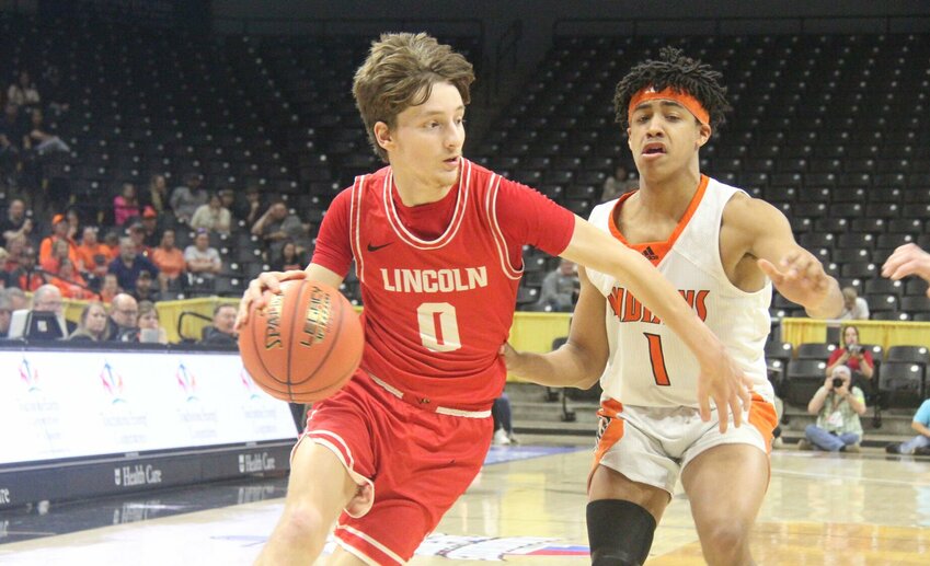 Lincoln junior Riley Sanders (0) drives past Puxico junior Landan Burchard (1) during the Class 2 third-place game Thursday, March 13, at Mizzou Arena.   Photo by Jack Denebeim | Democrat