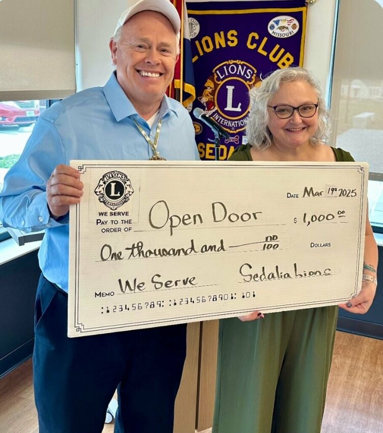 Sedalia Lions Club President Jeff Wimann presents a $1,000 donation to Open Door Volunteer &amp; Events Coordinator Jamie Bohlen on Wednesday, March 19. 


Photo courtesyof Jeff Wimann