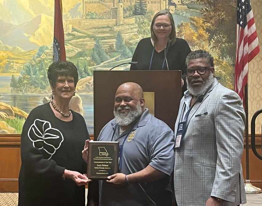 MONAHRO president Carol Barnham presents Dep. Larry Parham with both Peace Officer of the Year and Commissioner of the Year awards at the Missouri Chapter  of the National Association of Housing Redevelopment Officials Awards. Sedalia Housing executive director James Halliburton and deputy director Serena Jeffries join in the celebration.


Photo courtesy Larry Parham