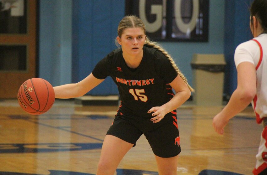 Northwest junior Gabby Meyer stares down a Stover defender during the Kaysinger Conference Tournament championship game Saturday, Feb. 8, at State Fair Community College. Meyer earned her second career All-State nod from the Missouri Basketball Coaches Association on Wednesday, March 19.&nbsp;   File photo by Jack Denebeim | Democrat