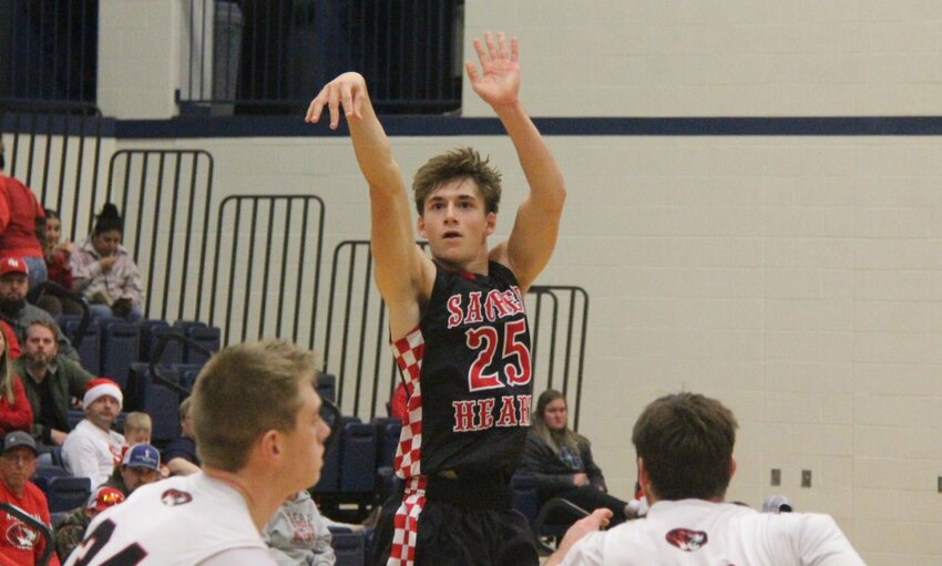 Sacred Heart junior Max Van Leer (25) rises above everyone to shoot a 3-pointer during the W-K Holiday Shootout game against Kingsville on Saturday, Dec. 21, at State Fair Community College. Van Leer was named the Class 1 District 7 co-Player of the Year by the Missouri Basketball Coaches Association on Monday, March 17.   File photo by Jack Denebeim | Democrat