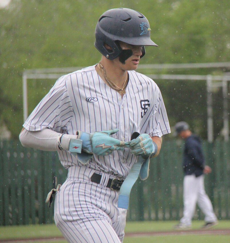 State Fair Community College's Dayne Wimberly jogs to first base as rain starts to fall during the at game last season. 


File photo by Jack Denebeim | Democrat