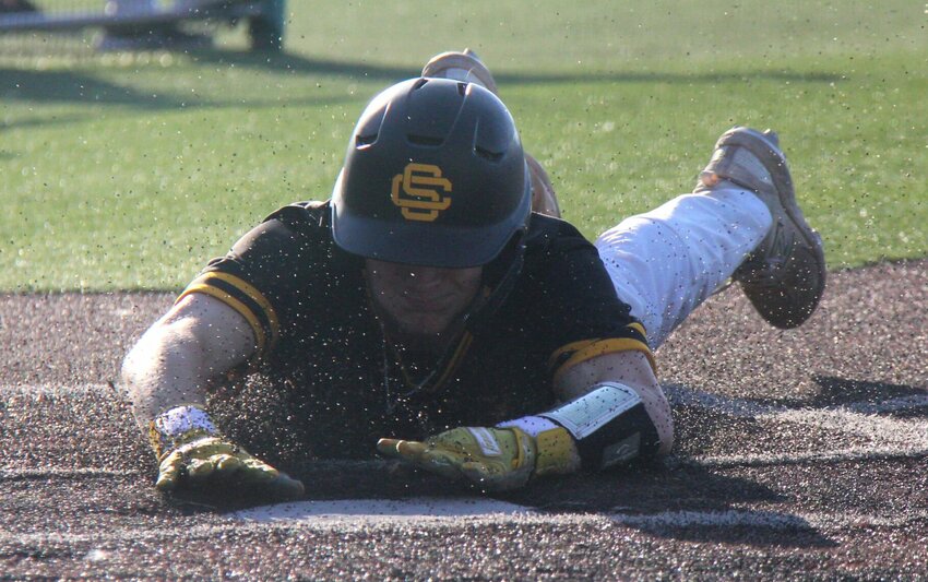 Smith-Cotton's Cooper Woolery slides into home to score a run during a game against Helias Catholic on May 9, 2024, at Liberty Park Stadium.   File photo by Jack Denebeim | Democrat