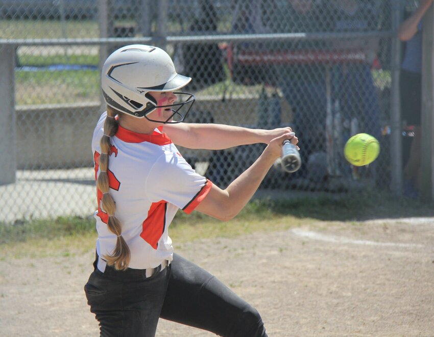Northwest's Gabby Meyer hits a ball during the Kaysinger Conference Softball Tournament semifinal game against Cole Camp last season. Meyer hit a home run in the Lady Mustangs' season opener on Friday, March 21.&nbsp;   File photo by Jack Denebeim | Democrat