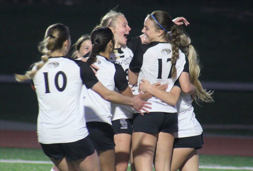 Smith-Cotton girls soccer celebrates a goal from freshman Avery Case (17) on Friday, April 11, at the Warrensburg Activities Complex.   Photo by Joe Andrews | Democrat