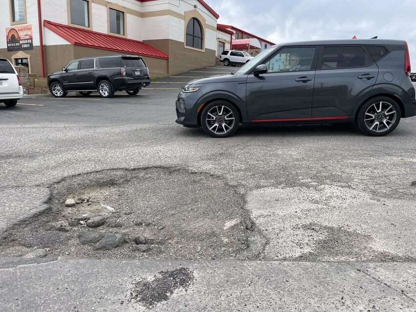 The popular shortcut between Staples and Walmart in behind Slim Chickens is showing wear with major potholes drivers must avoid. Who is responsible for the private road's maintenance is answered in Sedalia's easement agreement.


Photo by Chris Howell | Democrat
