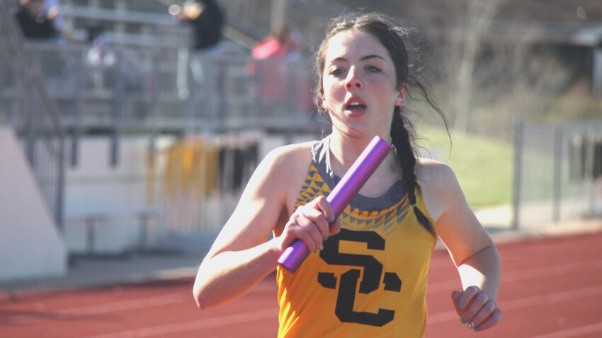 Smith-Cotton senior Julie Kuehner competes in a relay race during the Smith-Cotton Quad on March 21. Kuehner is a part of the girls 4x800-meter relay team that will compete in the 2025 Kansas Relays this weekend.