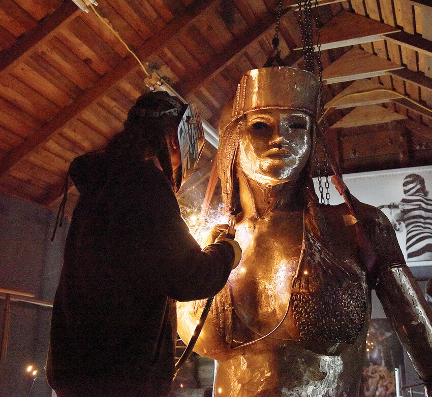 On Jan. 18, 2019, artist and State Fair Community College Art Department Head Don Luper works on a metal sculpture project at his Sedalia home. The large-scale sculpture lights up with a golden glow as Luper welds a portion of it in his studio. Luper created the sculpture with almost 500 pounds of wire.