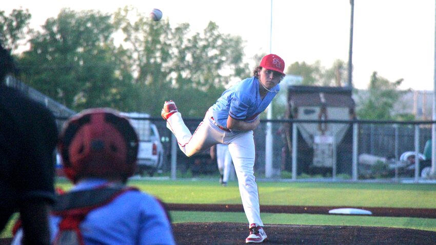Sacred Heart sophomore Miles Johnson pitches the ball during the Class 2 District 13 quarterfinal game on Thursday, May 15, at Liberty Park Stadium.