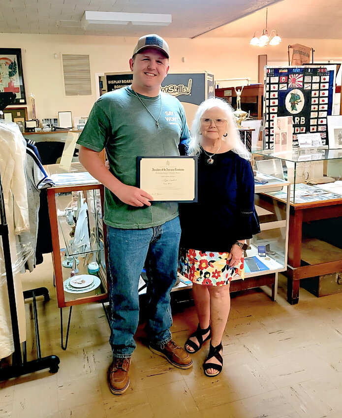 From left: Tyler Janke DESE, and Susan Rouchka history chair Osage Chapter DAR.