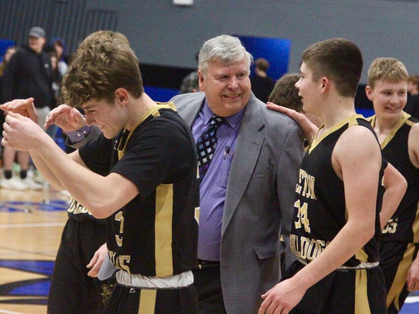 Coach Rick Mills converses with Leeton&rsquo;s Grant Harper after beating Harrisonville for his 800th career win on Friday, Feb. 11, 2022, at Harrisonville High School.