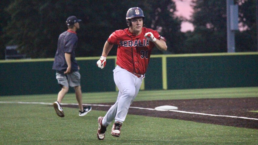 Sedalia Post 642 Senior Legion catcher Paxton Pyle rounds third to score a run during a game against Fike Post 499 on...