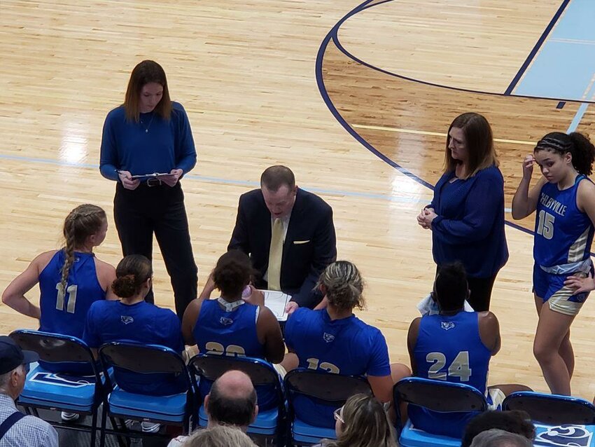 Eaglettes' Head Coach Kyle Turnham (center) gives instructions during a timeout against Coffee County.