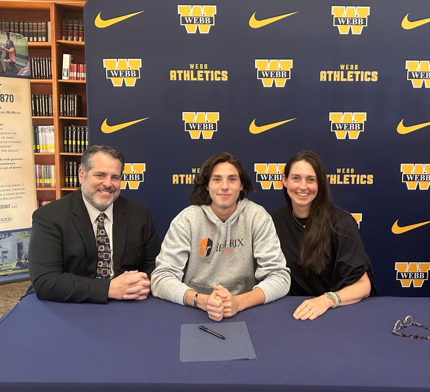Cecil Rodgers with his parents after signing to continue his soccer career for the Warriors of Hendrix College in Conway, Arkansas.