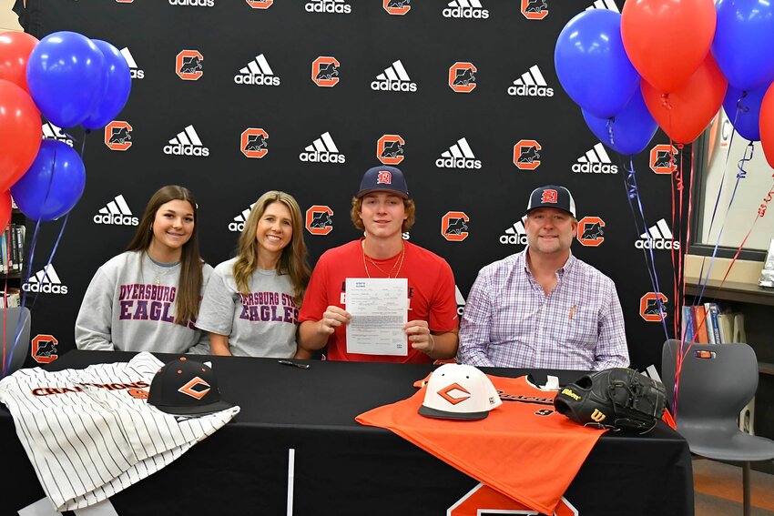 Walker Craig (center) signs with Dyersburg State CC on Monday.