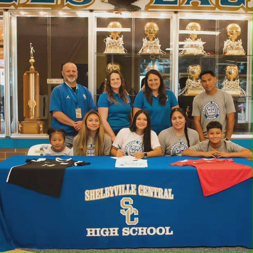 Jocelyn Hayitin (center) signs with Tennessee Wesleyan on Friday.