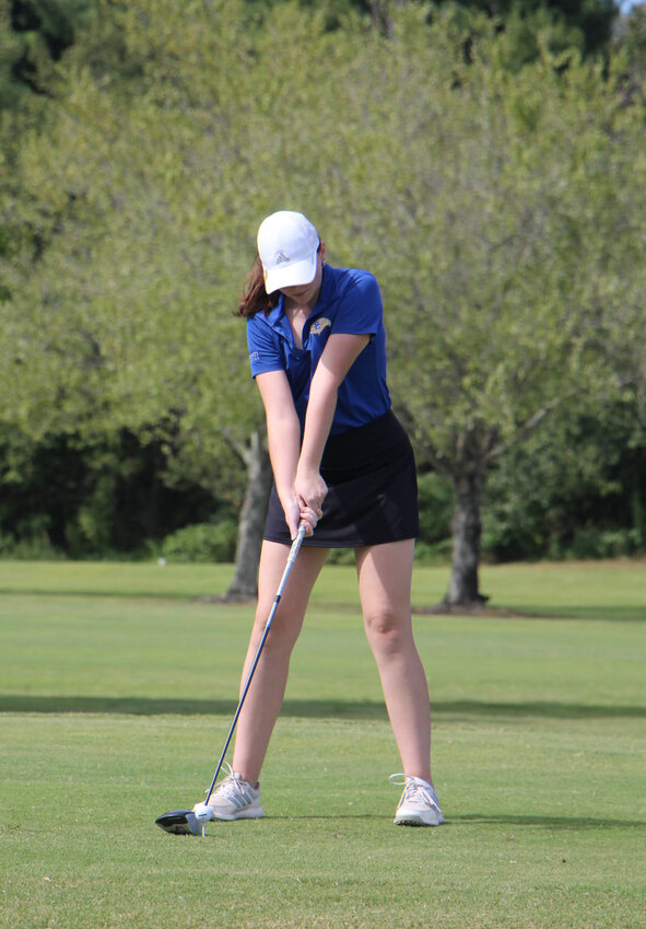 Anabel Leigh (pictured above) gets set for a tee shot during her senior season.