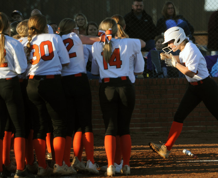 Hannah Vandriver is greeted by the Lady Champions after she crushed a two-run homer in the bottom of the first.