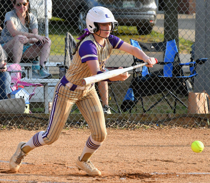 Abi Brown lays down a sacrifice bunt to score Abbi Murrill with the tying run in the first inning for the Viqueens.