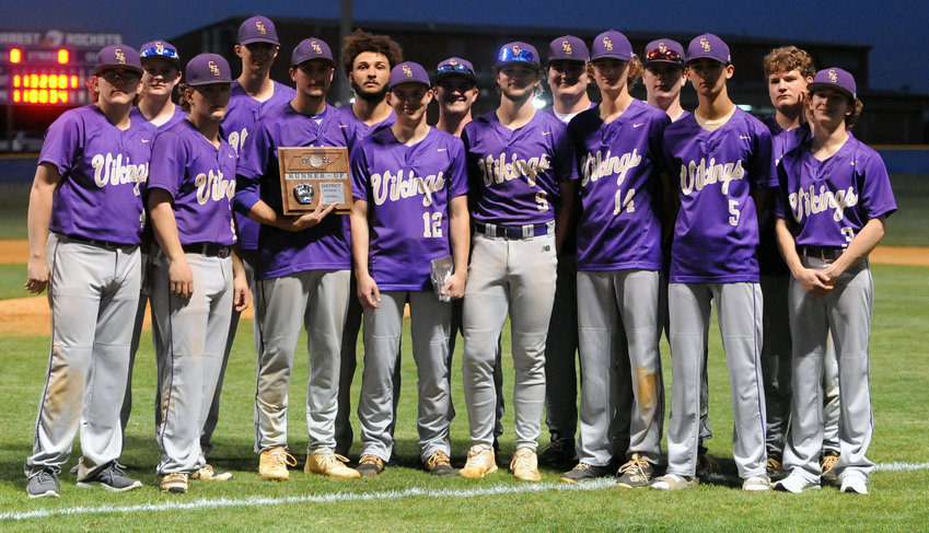 The Community Vikings pose with their runner-up plaque after Tuesday&rsquo;s District 7-AA championship at Forrest.