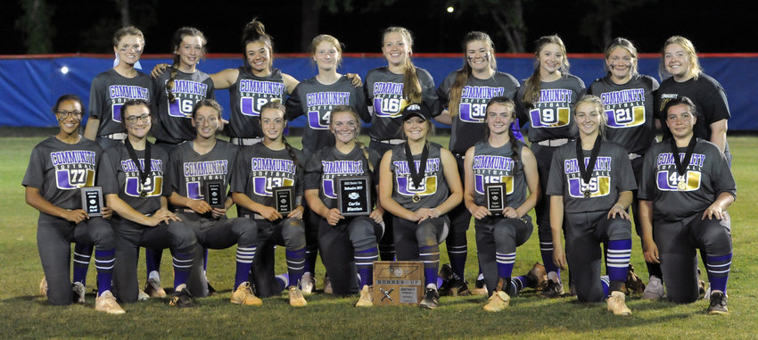 The Community Viqueens pose with their runner-up plaque after Thursday night&rsquo;s District 7-AA championship at Forrest.