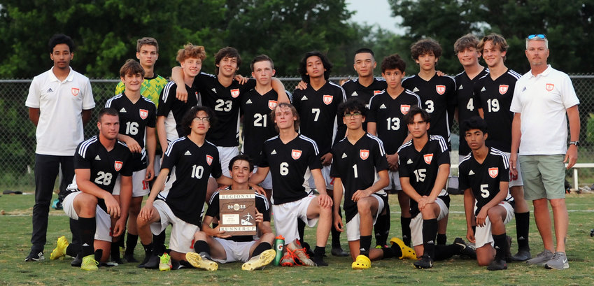The Cascade Champions pose with their Region 3-A runner up plaque following Wednesday's region championship.