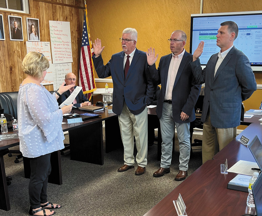 Bedford County Board of Education members recently sworn in by Bedford County Court Clerk Donna Thomas are, from left, Barton Williams and incumbents Dan Reed and Brian Crews. Current board member Glenn Forsee is in the background. Courtney Bogle and Shanna Boyette, not pictured, were sworn in recently during a ceremony at Bedford County Courthouse.