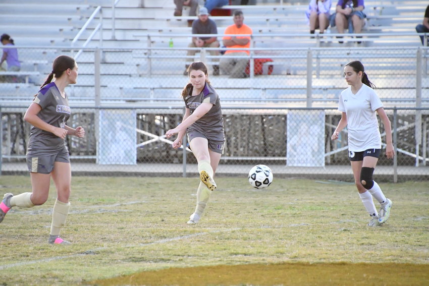 Addison Brothers drills the ball upfield for the Viqueens.  `