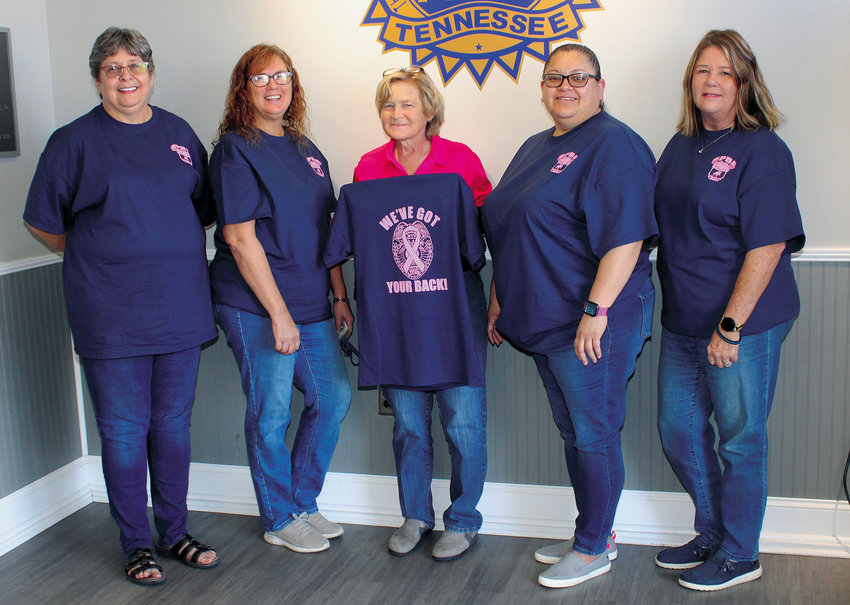 Several staff members at Shelbyville Police Department display National Cancer Awareness Month t-shirts being sold by Shelbyville Police Benevolent Association, From left are Kerry Dunn, Sheri Rhodes, Detective Carol Jean, Lilia Torres, and Kim Nash.