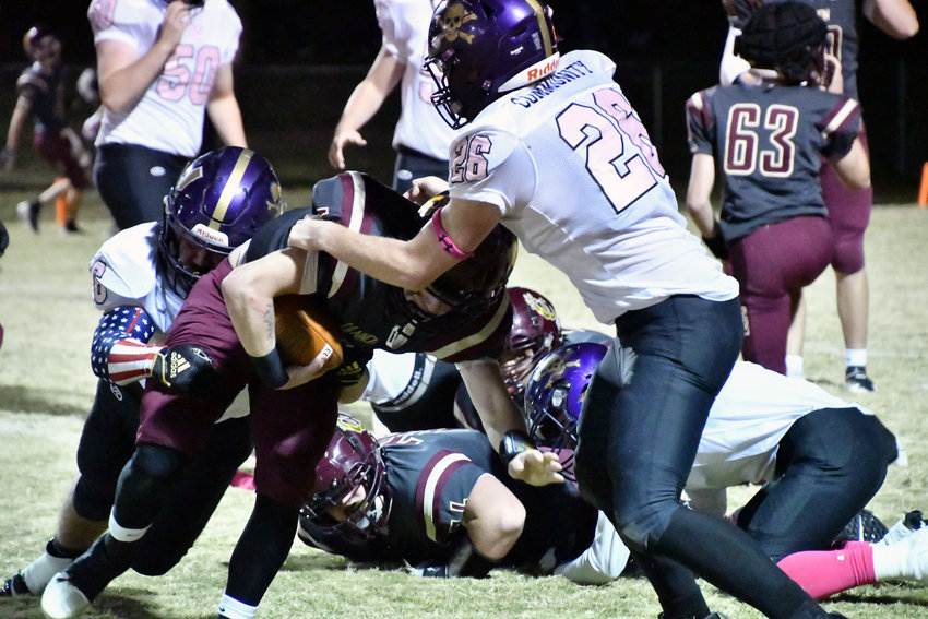 James Bowling (16) and Jordan Land (26) of the Vikings make the stop on a Cannon County runner.