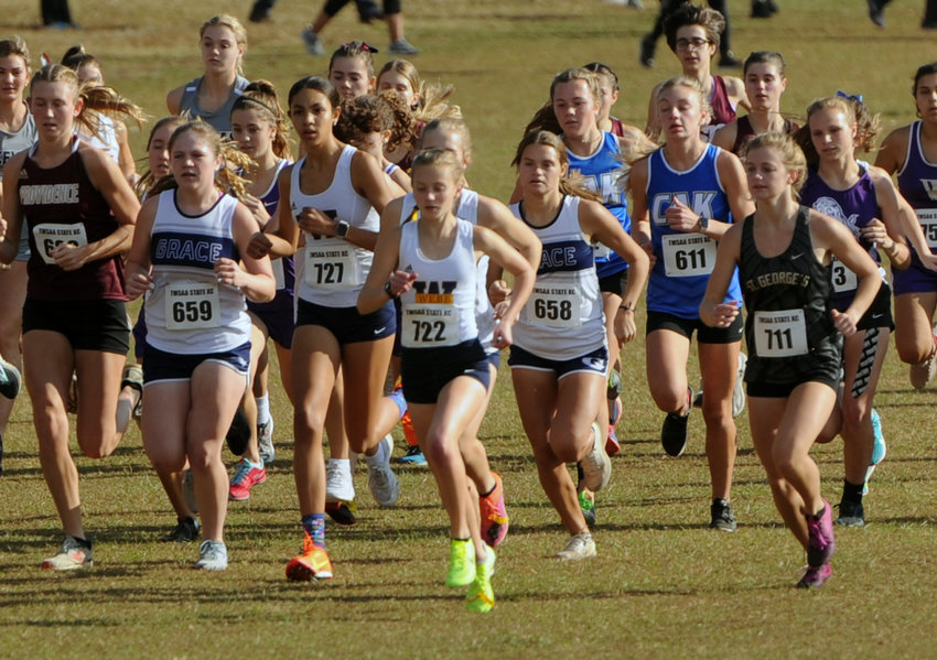 The Lady Feet fight for positioning after the start of the Div. II Class A state cross country meet on Friday at Sanders Ferry.