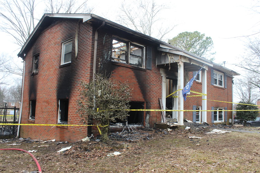 The charred exterior reflects the intensity of the fire that destroyed the home of Michael and Brittany Preston and their family on Blue Ribbon Parkway early Wednesday.