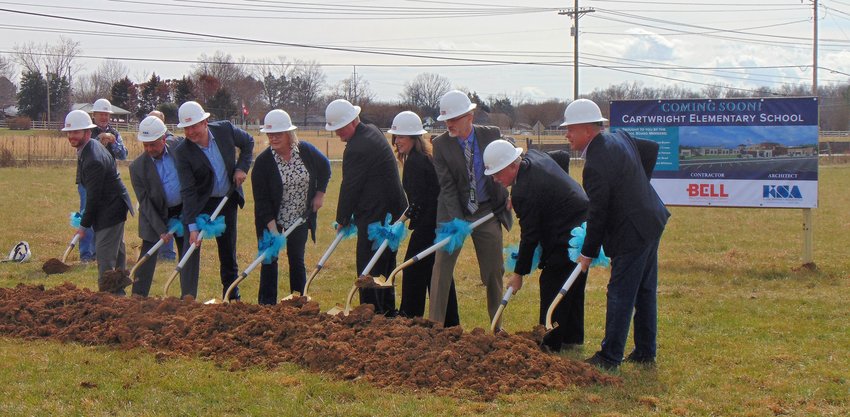 Suzy Cartwright Johnson, fourth from the left, helps break ground.